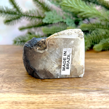 Natural Agate Bookend. Features a slice of cut crystal with raw geode edge and polished inside. Not dyed or heat treated.