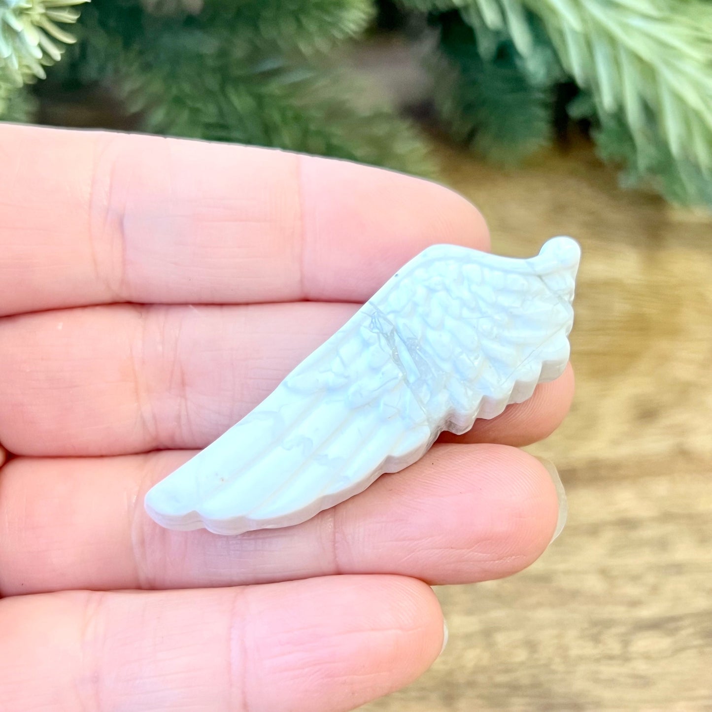 Natural and authentic Magnesite carved crystal cabochon. This Stone Cabochon has been carved into an angel wing
