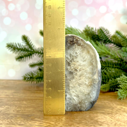 Natural Agate Bookend. Features a slice of cut crystal with raw geode edge and polished inside. Not dyed or heat treated.